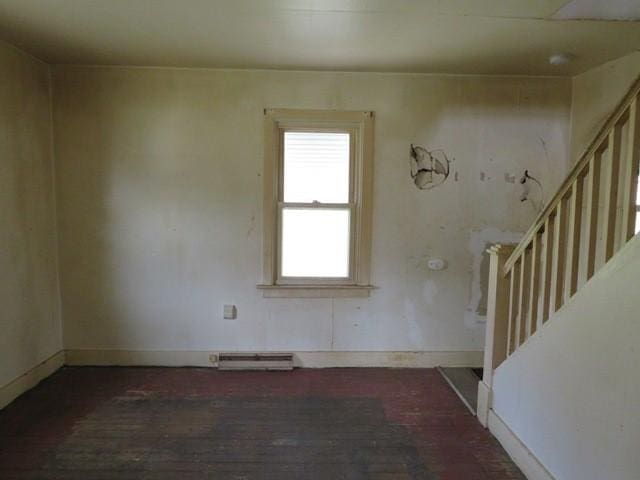 501 Adams St, West Newton, PA 15089 - unfurnished room featuring wood-type flooring, stairs, and a baseboard heating unit