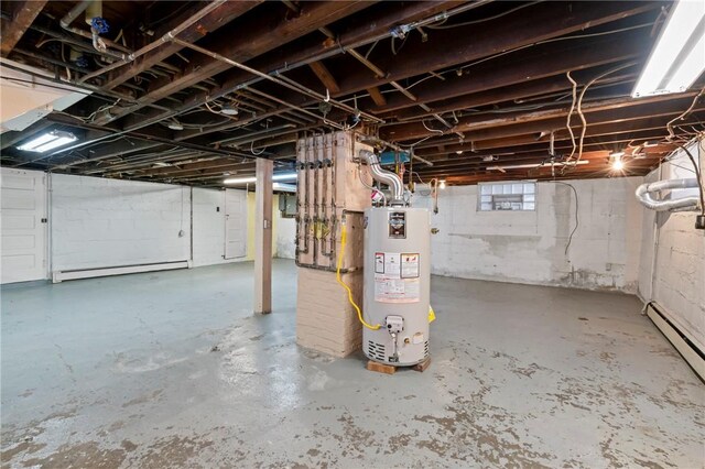 below grade area featuring gas water heater and a baseboard heating unit