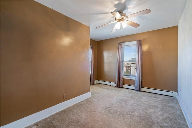empty room featuring carpet flooring, ceiling fan, and baseboards