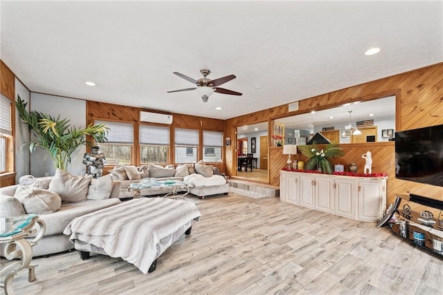 19 Misty Meadows Ln, Menallen Twp, PA 15401 - living area featuring wooden walls, ceiling fan, an AC wall unit, recessed lighting, and light wood-style flooring