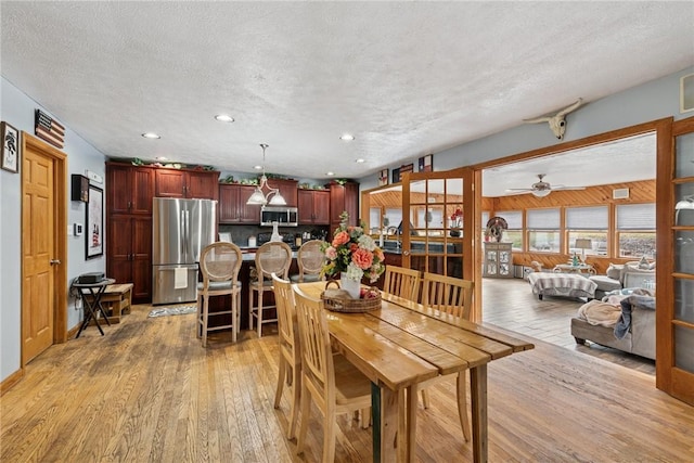 19 Misty Meadows Ln, Menallen Twp, PA 15401 - dining room featuring light wood finished floors, a textured ceiling, recessed lighting, and ceiling fan