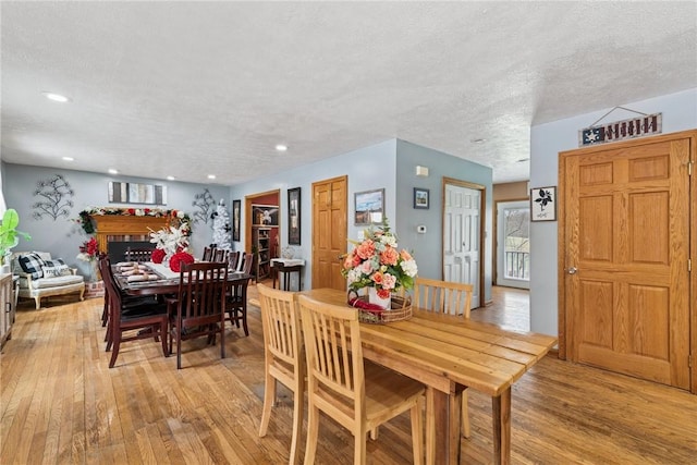 19 Misty Meadows Ln, Menallen Twp, PA 15401 - dining area featuring light wood-style floors, recessed lighting, and a textured ceiling