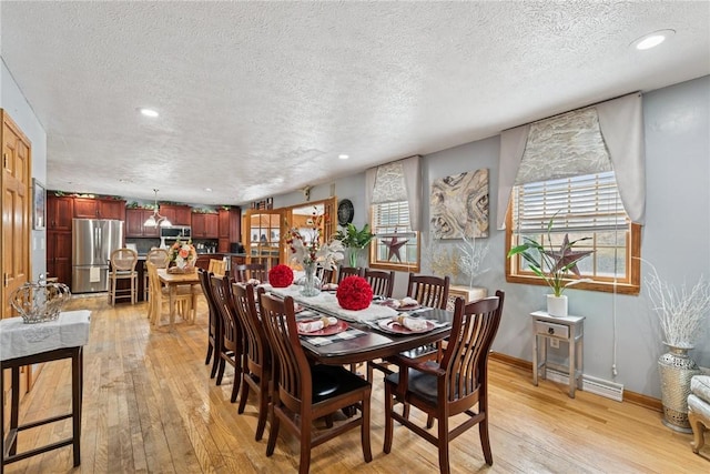 19 Misty Meadows Ln, Menallen Twp, PA 15401 - dining area with light wood-style flooring, a textured ceiling, and recessed lighting