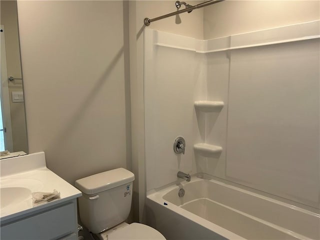 full bath featuring toilet, bathtub / shower combination, and vanity