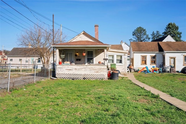 1101 11th St, Stowe Twp, PA 15136 - rear view of property featuring a lawn, a chimney, and fence