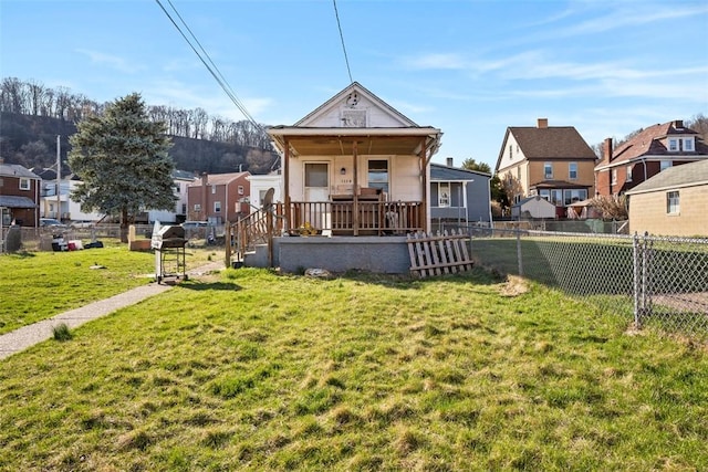 1114 11th St, Stowe Twp, PA 15136 - view of front of property featuring a residential view, a front yard, covered porch, and fence private yard