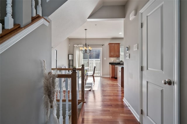 2802 Jane St, South Side, PA 15203 - corridor featuring wood finished floors, a chandelier, and baseboards