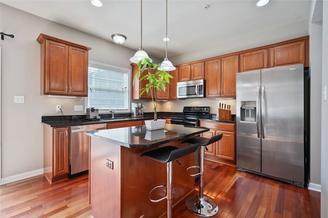 2802 Jane St, South Side, PA 15203 - kitchen featuring stainless steel appliances, brown cabinets, a center island, and recessed lighting