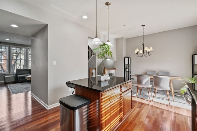 2802 Jane St, South Side, PA 15203 - kitchen with hardwood / wood-style flooring, baseboards, open floor plan, a kitchen island, and recessed lighting