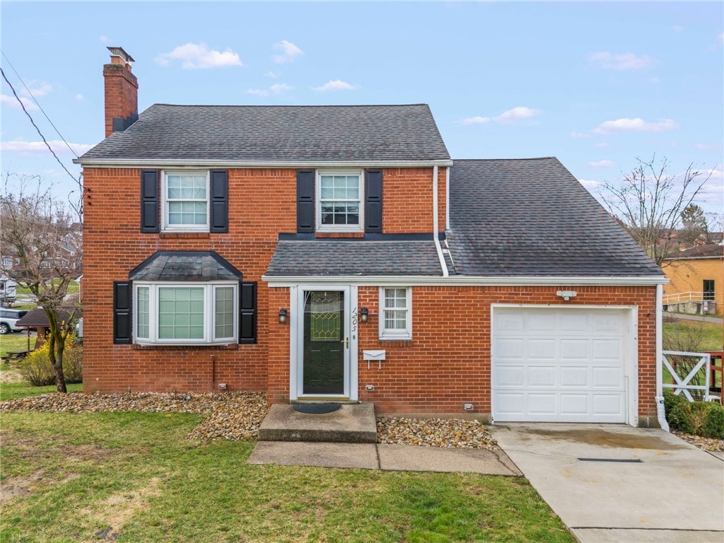 1205 Greenock Buena Vista Rd, Elizabeth Twp/Boro, PA 15135 - traditional-style house with roof with shingles, driveway, a front yard, brick siding, and a chimney