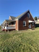 1203 Vine St, West Newton, PA 15089 - back of house with a lawn