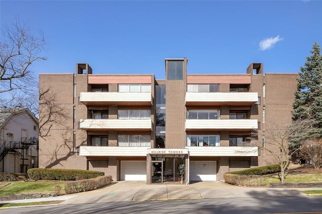 5841 Morrowfield Ave Unit 104, Squirrel Hill, PA 15217 - view of property with driveway and a garage