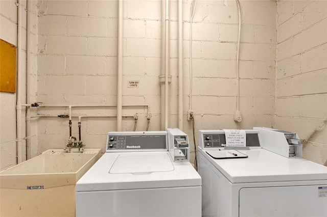 5841 Morrowfield Ave Unit 104, Squirrel Hill, PA 15217 - clothes washing area with washer and dryer and a sink