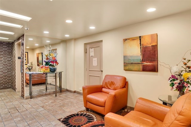 5841 Morrowfield Ave Unit 104, Squirrel Hill, PA 15217 - living room with a skylight, brick wall, and recessed lighting