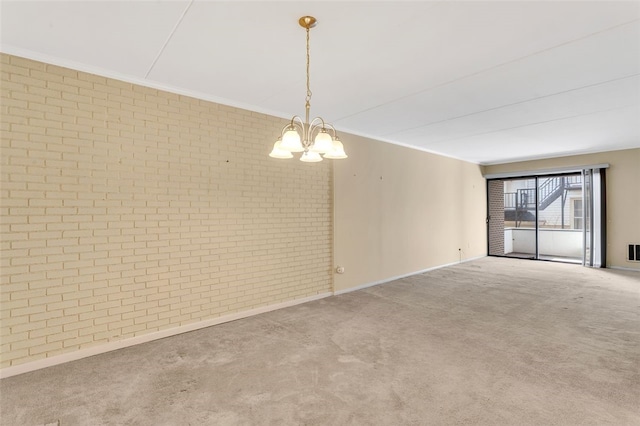 5841 Morrowfield Ave Unit 104, Squirrel Hill, PA 15217 - spare room featuring a chandelier, brick wall, visible vents, ornamental molding, and carpet
