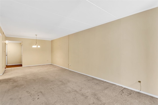 5841 Morrowfield Ave Unit 104, Squirrel Hill, PA 15217 - empty room with an inviting chandelier, light carpet, crown molding, and baseboards