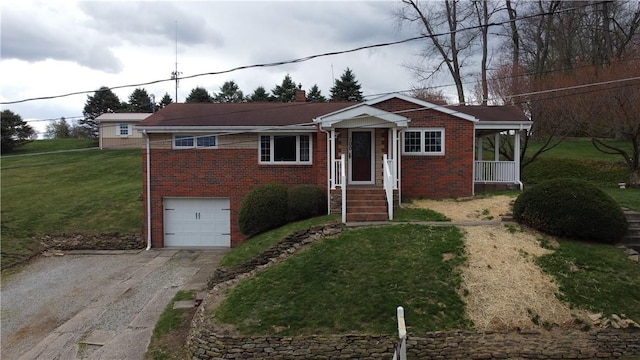 view of front of home featuring a chimney, a front lawn, aphalt driveway, brick siding, and a garage