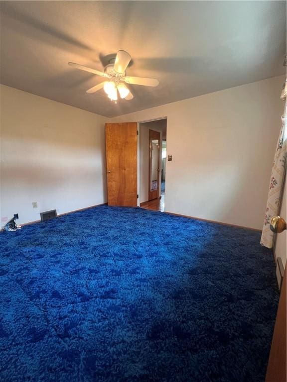 unfurnished bedroom with visible vents, carpet flooring, and ceiling fan