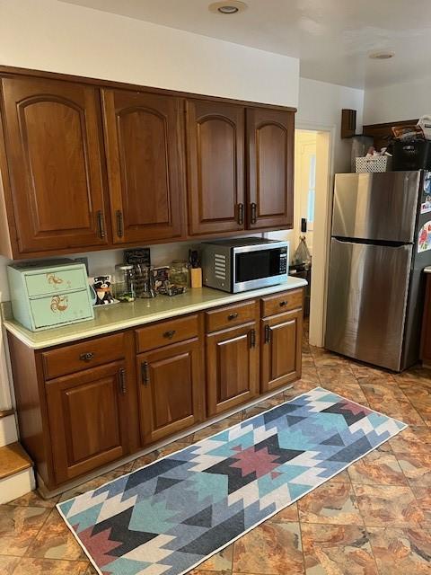111 Mckenney Dr, Brighton Twp, PA 15009 - kitchen with light countertops, appliances with stainless steel finishes, and brown cabinets