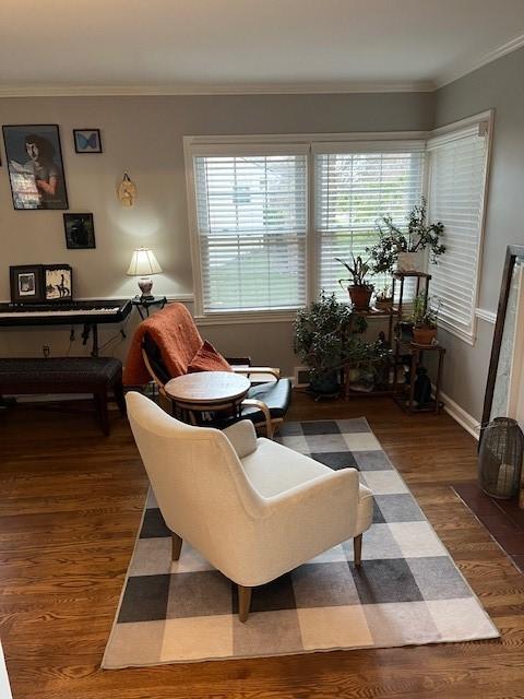111 Mckenney Dr, Brighton Twp, PA 15009 - living area featuring baseboards, ornamental molding, a healthy amount of sunlight, and wood finished floors