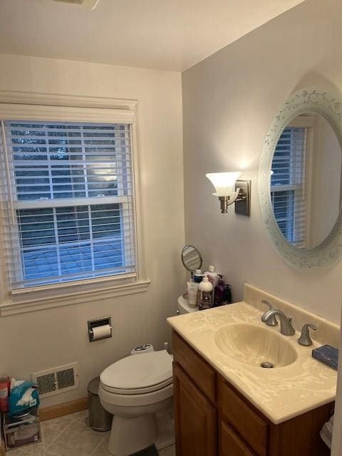 111 Mckenney Dr, Brighton Twp, PA 15009 - half bathroom with visible vents, vanity, toilet, baseboards, and tile patterned floors