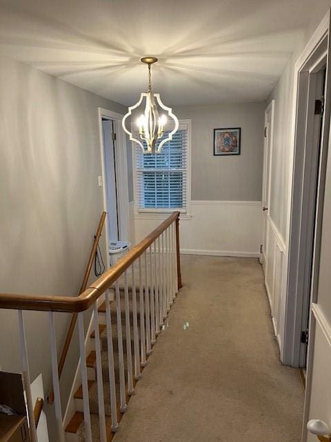111 Mckenney Dr, Brighton Twp, PA 15009 - corridor with light colored carpet, a notable chandelier, and an upstairs landing