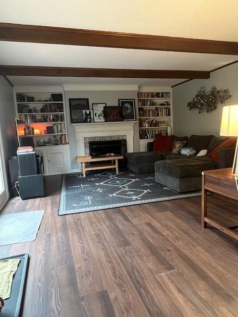 111 Mckenney Dr, Brighton Twp, PA 15009 - living area with built in features, a tiled fireplace, beam ceiling, and wood finished floors
