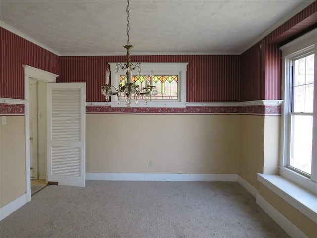 437 Shady Ave, Charleroi Boro, PA 15022 - unfurnished dining area with carpet flooring, an inviting chandelier, ornamental molding, and baseboards