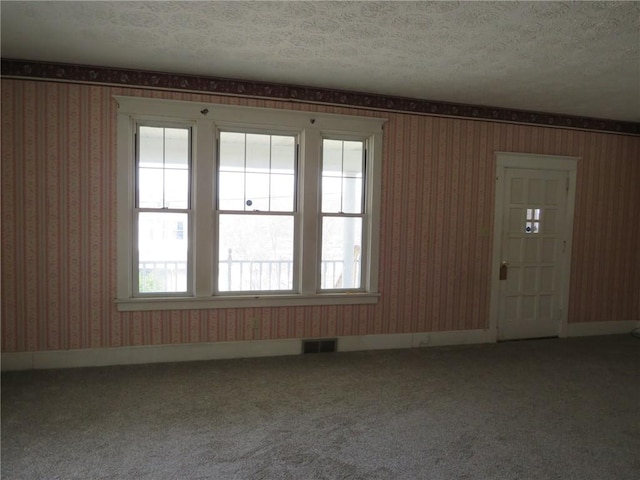 437 Shady Ave, Charleroi Boro, PA 15022 - empty room with visible vents, wallpapered walls, carpet floors, and a textured ceiling