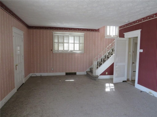 437 Shady Ave, Charleroi Boro, PA 15022 - interior space featuring carpet, visible vents, wallpapered walls, and stairs