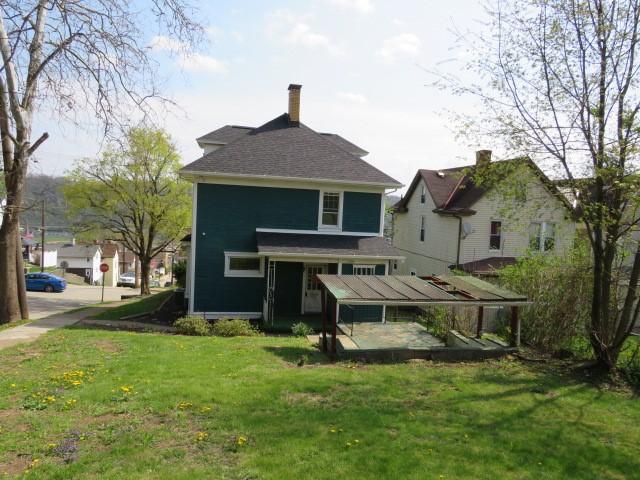 437 Shady Ave, Charleroi Boro, PA 15022 - back of house featuring a chimney and a yard