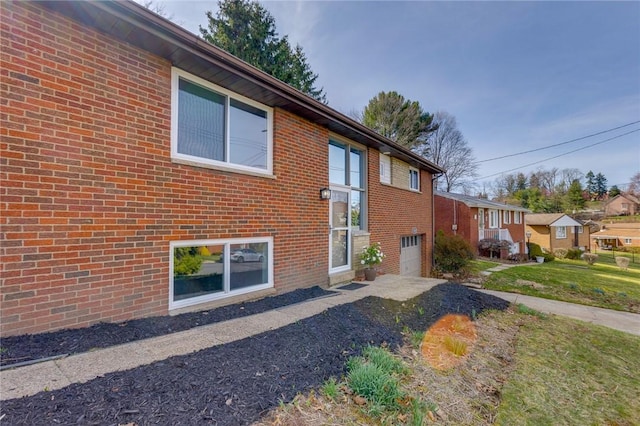 130 Castle, West Mifflin, PA 15122 - exterior space with brick siding, driveway, a garage, and a yard