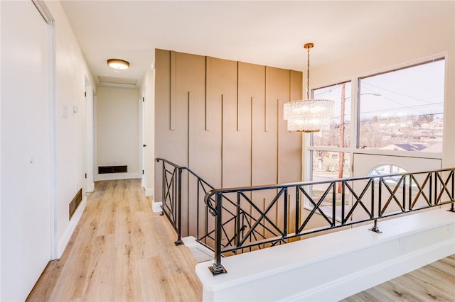 130 Castle, West Mifflin, PA 15122 - stairway with visible vents, a notable chandelier, and wood finished floors