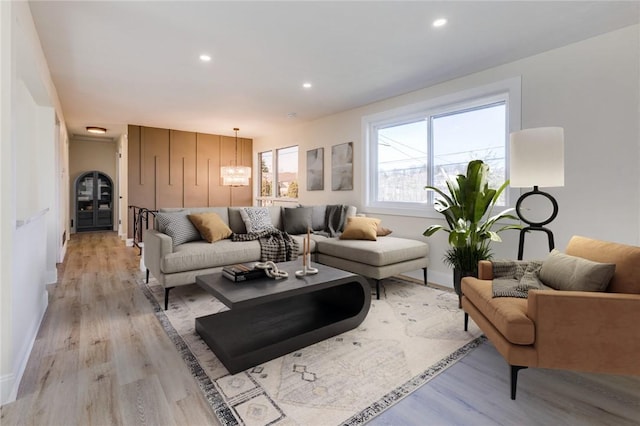 130 Castle, West Mifflin, PA 15122 - living room featuring baseboards, recessed lighting, an inviting chandelier, and light wood-style floors