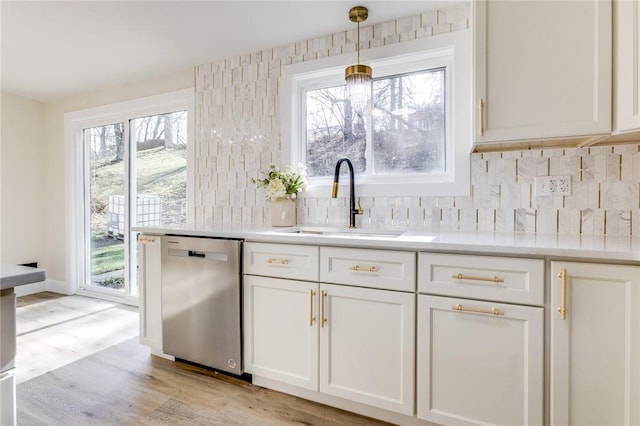 130 Castle, West Mifflin, PA 15122 - kitchen featuring white cabinets, a sink, a healthy amount of sunlight, and dishwasher