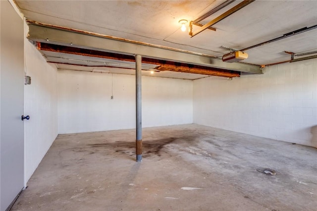 130 Castle, West Mifflin, PA 15122 - below grade area featuring a garage and concrete block wall