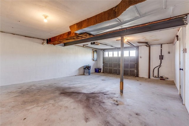 130 Castle, West Mifflin, PA 15122 - garage with concrete block wall and a garage door opener