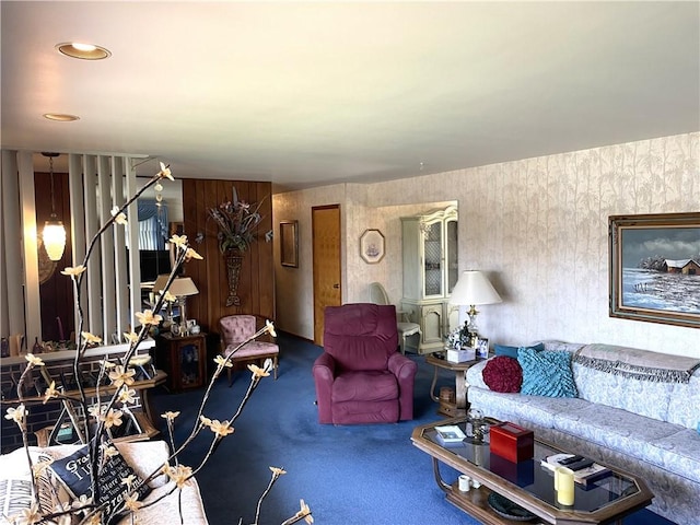 living room featuring carpet flooring and stairway