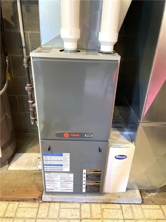 utility room with heating unit