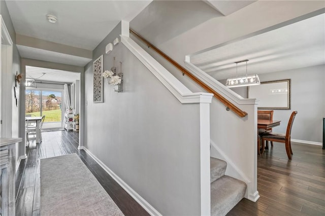 145 Brighton Ln, Adams Twp, PA 16046 - hallway with baseboards, dark wood-type flooring, and stairway