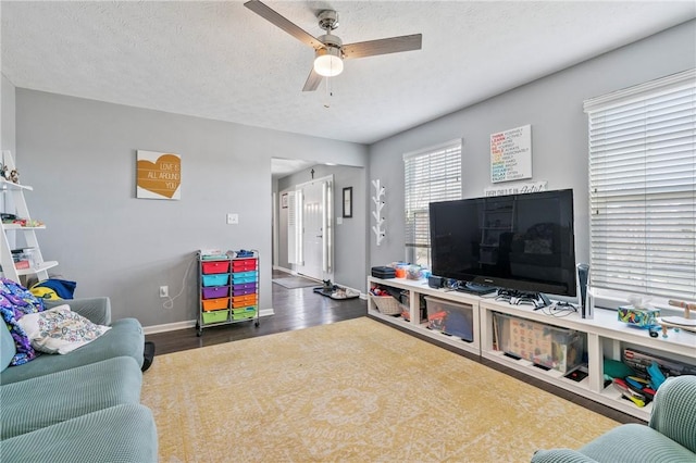 145 Brighton Ln, Adams Twp, PA 16046 - living room featuring ceiling fan, wood finished floors, baseboards, and a textured ceiling