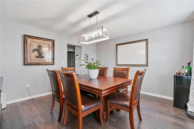 145 Brighton Ln, Adams Twp, PA 16046 - dining area featuring dark wood-style floors and baseboards