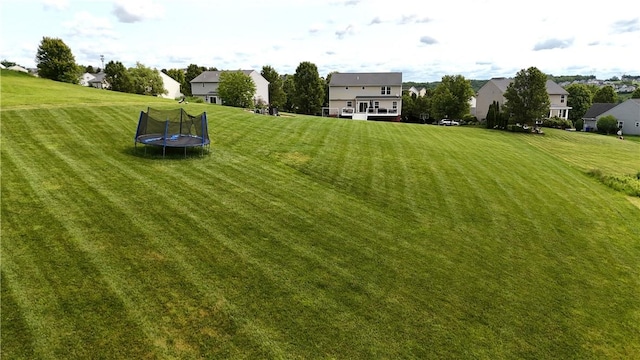 145 Brighton Ln, Adams Twp, PA 16046 - view of green lawn featuring a residential view and a trampoline