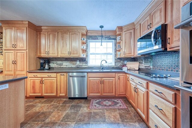 kitchen featuring dark countertops, open shelves, stainless steel appliances, a sink, and tasteful backsplash