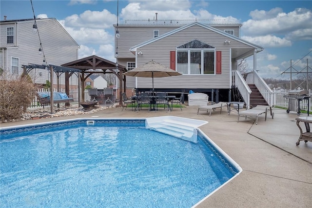 view of swimming pool with a patio, fence, and a pergola