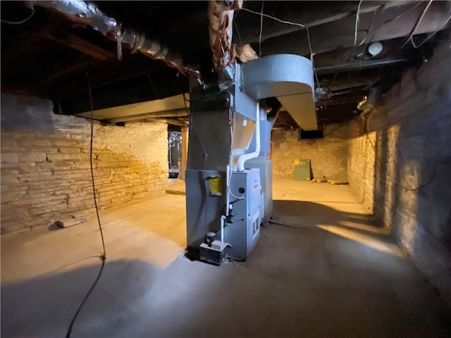 unfinished below grade area featuring heating unit