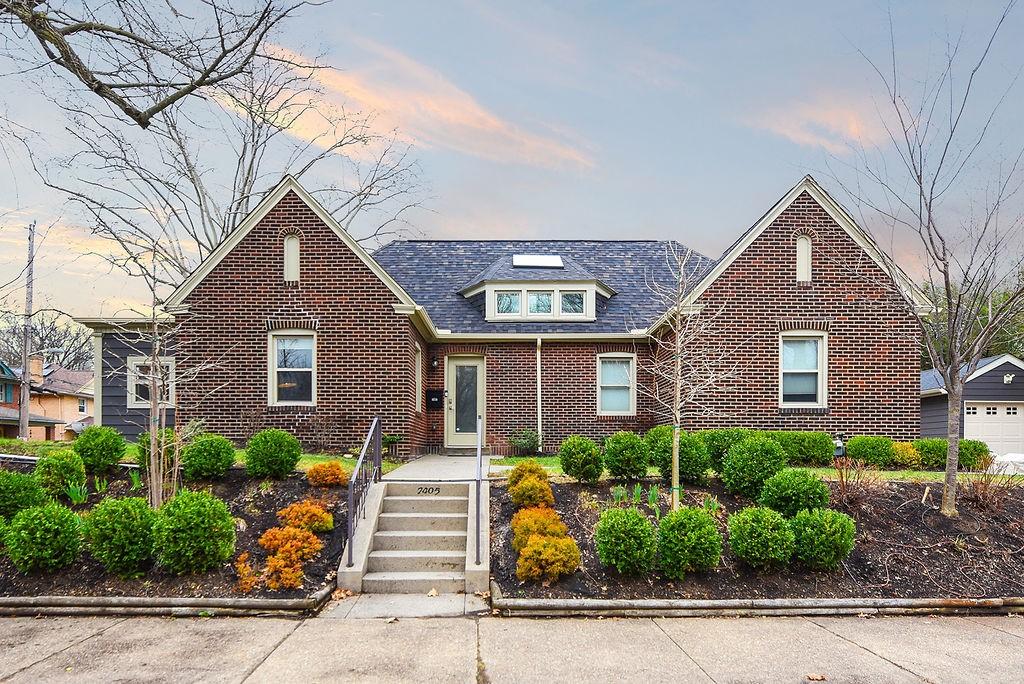 view of front of house with brick siding