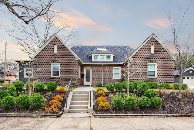 view of front of house with brick siding