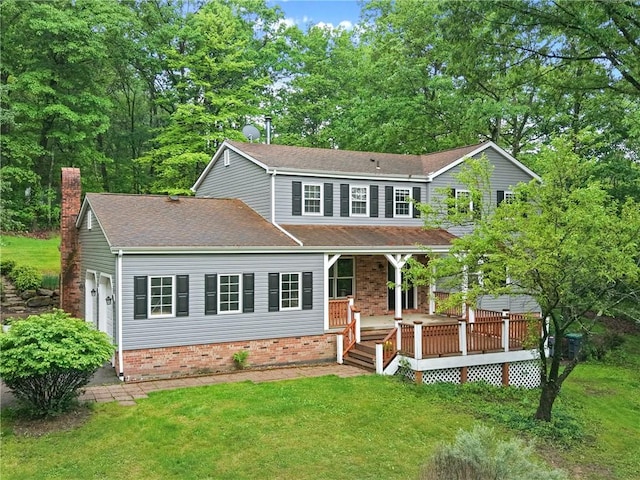 1547 Garvin Rd, Cranberry Twp, PA 16066 - view of front of property with a front lawn, a chimney, and brick siding