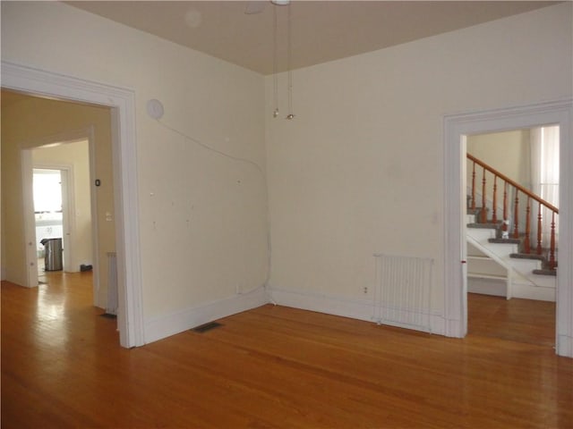 161 Ord St, Salisbury, PA 15558 - unfurnished room with radiator, visible vents, wood finished floors, and stairway